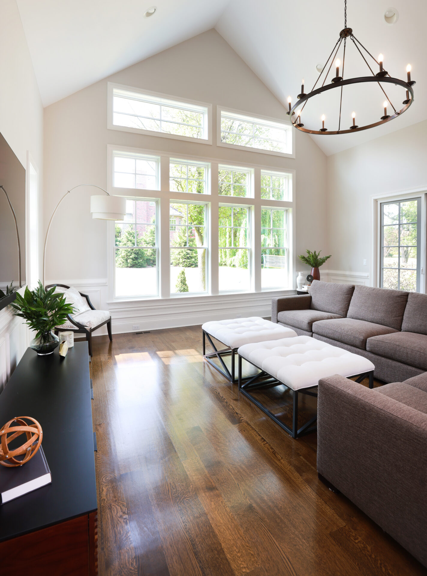 White vaulted ceiling with chandelier and many windows