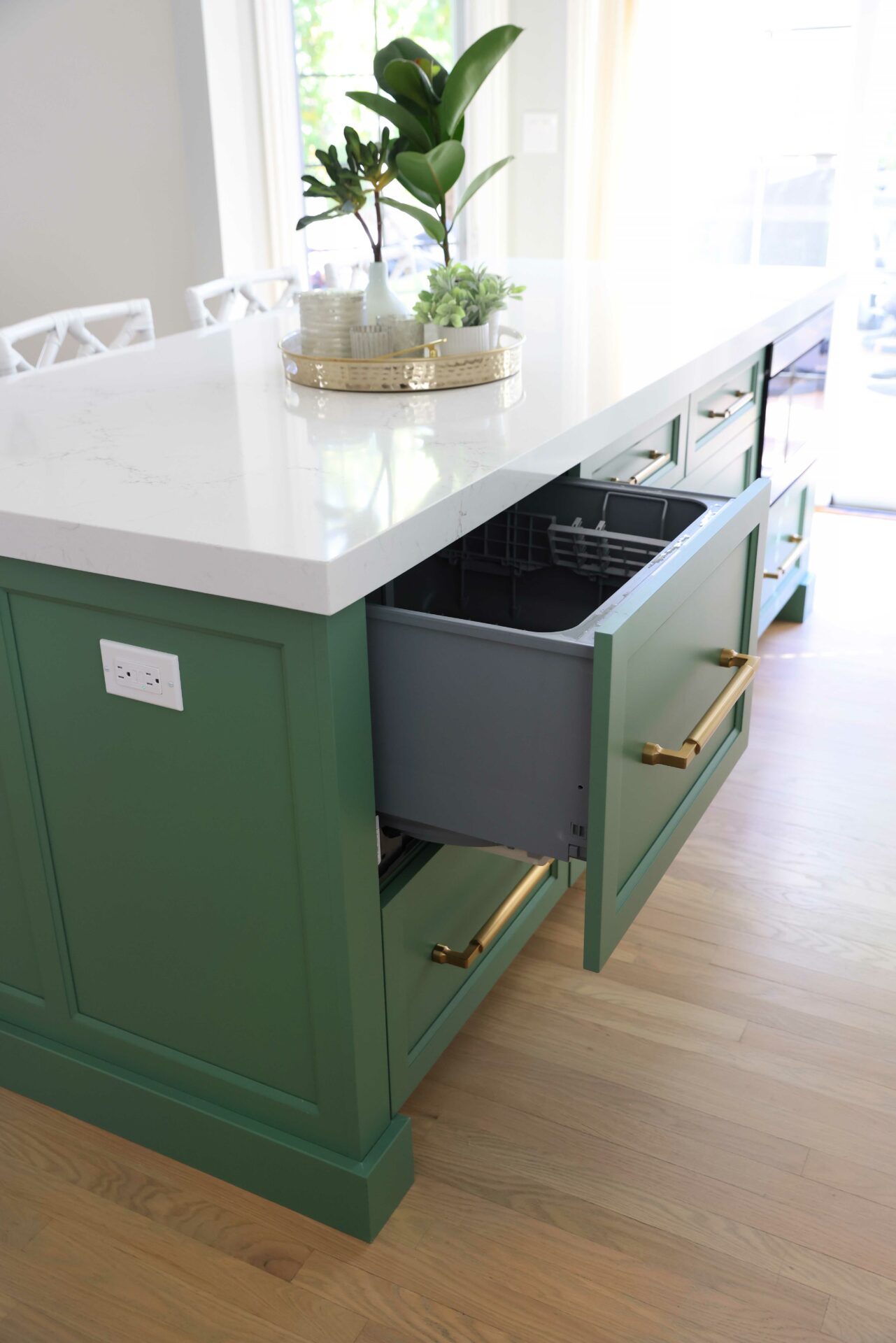 Green kitchen island with dishwasher drawer