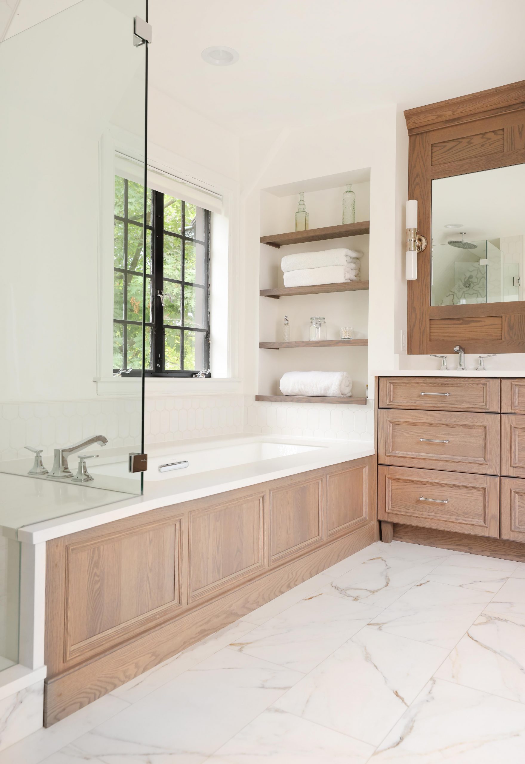 primary suite with bath tub with tub deck and separate shower